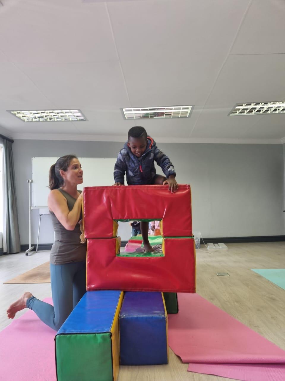 Child climbing soft play structure